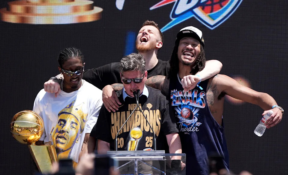 Oklahoma City's Jalen Williams, left, Isaiah Hartenstein and Jaylin Williams help Oklahoma City Mayor David Holt with his speech at Scissortail Park as the Oklahoma City Thunder celebrate their first NBA Finals title win with a champions parade throughout downtown Oklahoma City on Tuesday, June 24, 2025.