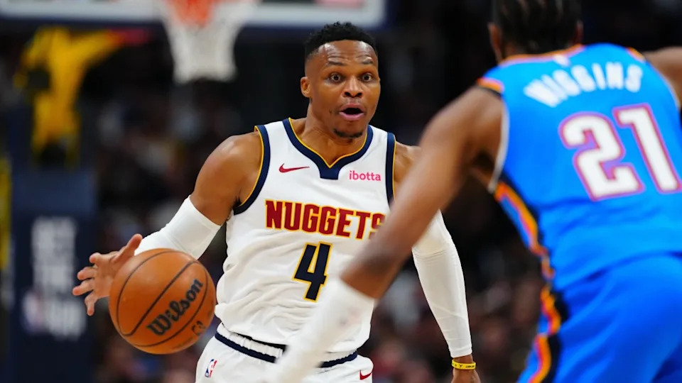 Oct 24, 2024; Denver, Colorado, USA; Denver Nuggets guard Russell Westbrook (4) drives at Oklahoma City Thunder guard Aaron Wiggins (21) in the second half at Ball Arena. Mandatory Credit: Ron Chenoy-Imagn Images© Ron Chenoy-Imagn Images