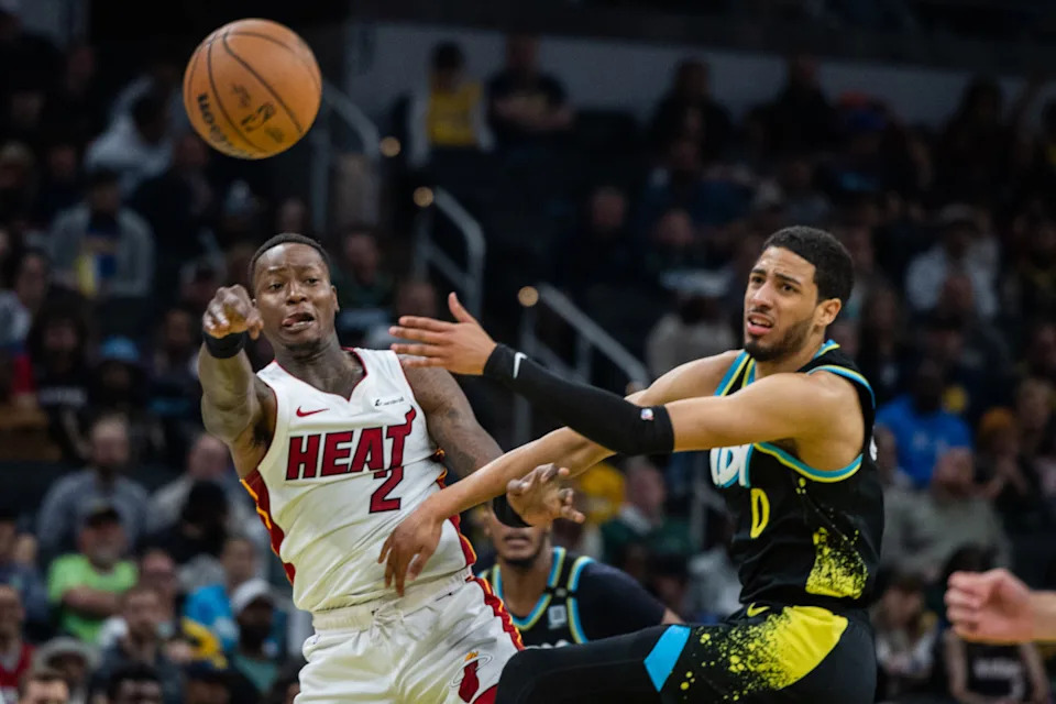Apr 7, 2024; Indianapolis, Indiana, USA; Miami Heat guard Terry Rozier (2) passes the ball while Indiana Pacers guard Tyrese Haliburton (0) defends in the second half at Gainbridge Fieldhouse. Mandatory Credit: Trevor Ruszkowski-Imagn Images© Trevor Ruszkowski-Imagn Images