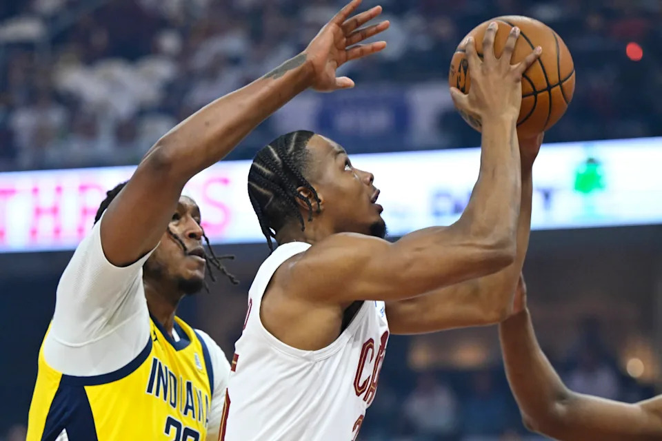 Cavaliers forward Isaac Okoro (35) shoots beside Pacers center Myles Turner (33).David Richard-Imagn Images