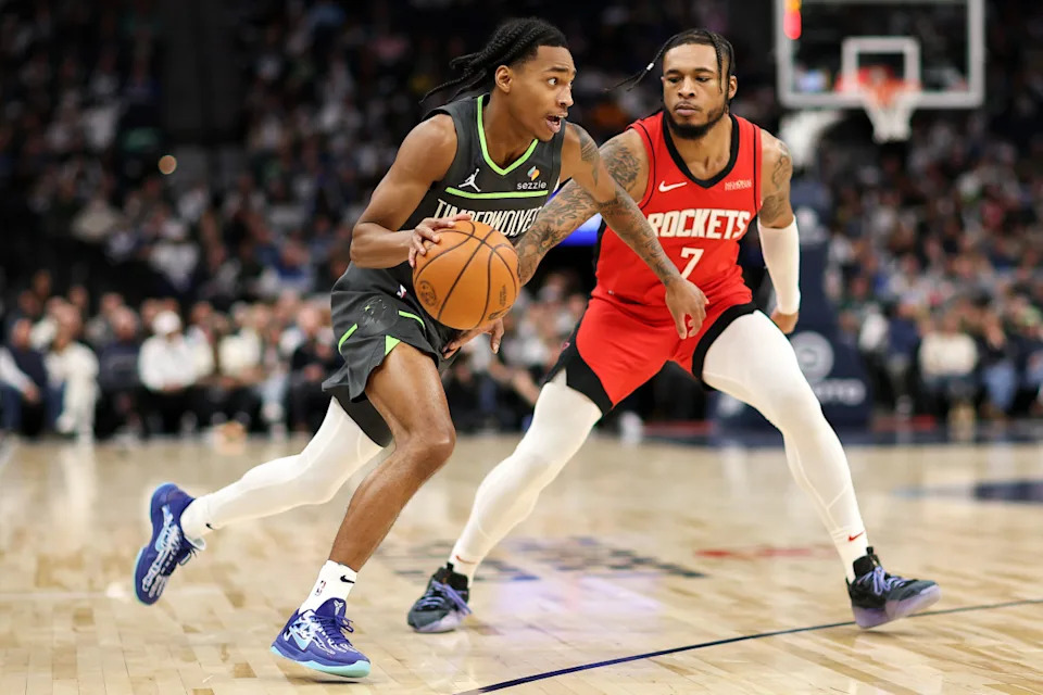 Feb 6, 2025; Minneapolis, Minnesota, USA; Minnesota Timberwolves guard Rob Dillingham (4) works around Houston Rockets forward Cam Whitmore (7) during the third quarter at Target Center. Mandatory Credit: Matt Krohn-Imagn ImagesCredit: Matt Krohn-Imagn Images