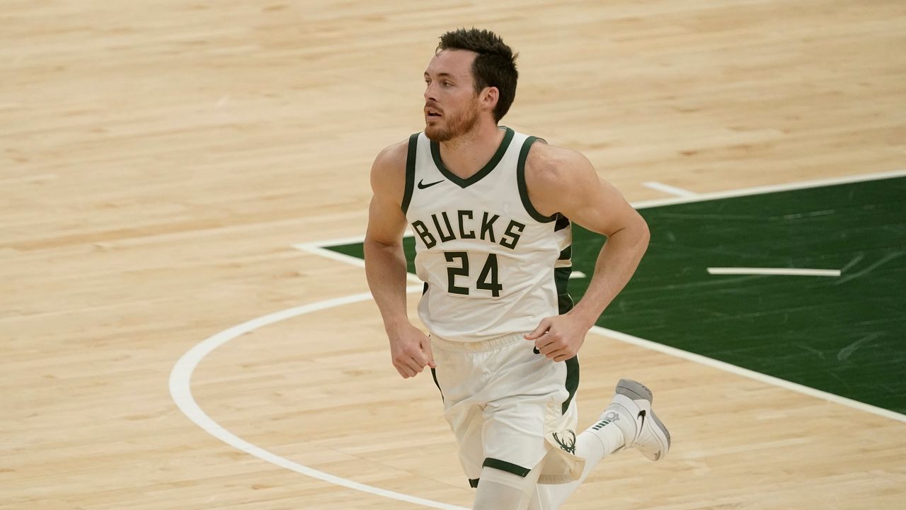 Milwaukee Bucks' Pat Connaughton runs during the first half of an NBA basketball game against the Memphis Grizzlies Saturday, April 17, 2021, in Milwaukee.