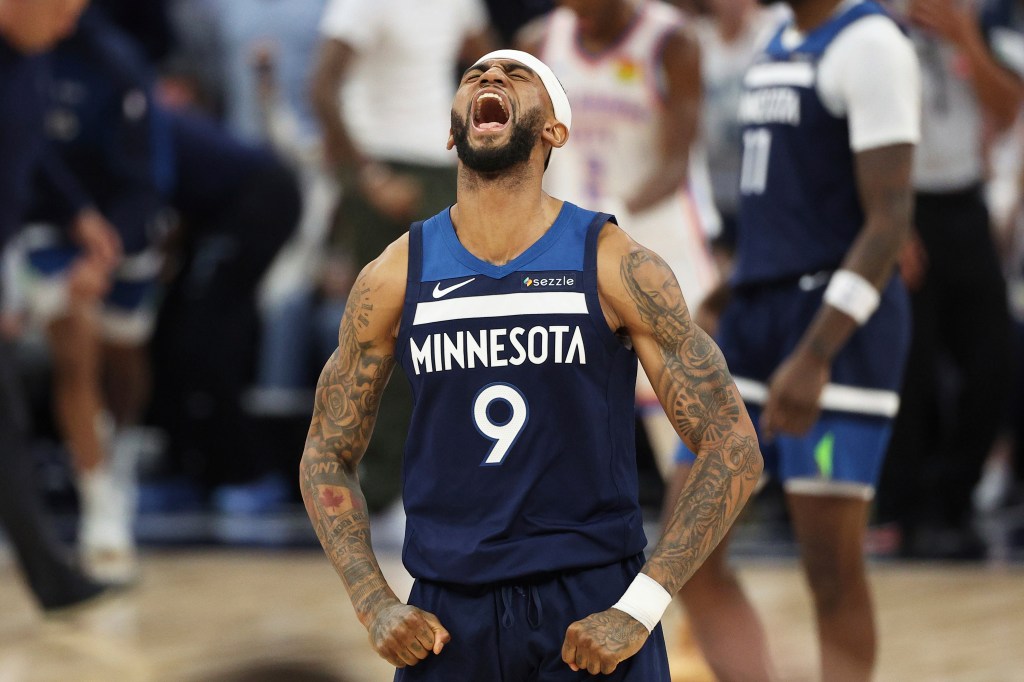 Minnesota Timberwolves guard Nickeil Alexander-Walker (9) celebrates after a 3-point basket by Donte DiVincenzo during the second half of Game 4 of the Western Conference finals of the NBA basketball playoffs against the Oklahoma City Thunder Monday, May 26, 2025, in Minneapolis.