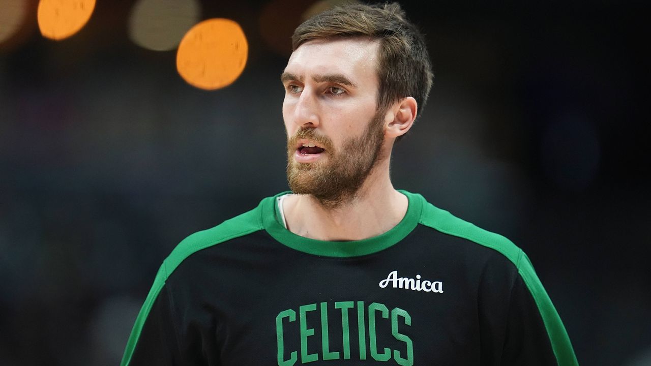 Boston Celtics center Luke Kornet looks on in the first half of an NBA basketball game, Jan. 7, 2025, in Denver. (AP Photo/David Zalubowski)