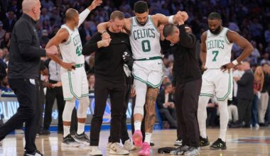 Trainers help Boston Celtics' Jayson Tatum (0) off the court after he was injured during the second half of Game 4 in the Eastern Conference semifinals of the NBA basketball playoffs against the New York Knicks, May 12, 2025, in New York. (AP Photo/Frank Franklin II, File)