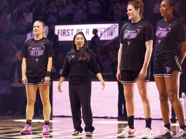 Valkyries' Julie Vanloo (35), Golden State Valkyries head coach Natalie Nakase, Golden State Valkyries' Kyara Linskens, and Valkyries' Monique Billings stand on the court before the home opener against the Los Angeles Sparks at the Chase Center in San Francisco, Calif., on Friday, May 16, 2025. (Shae Hammond/Bay Area News Group)