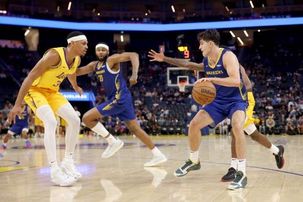 Golden State Warriors' Taran Armstrong (1) dribbles against the Los Angeles Lakers in the third quarter of an NBA Summer League game at Chase Center in San Francisco, Calif., on Saturday, July 5, 2025. (Ray Chavez/Bay Area News Group)