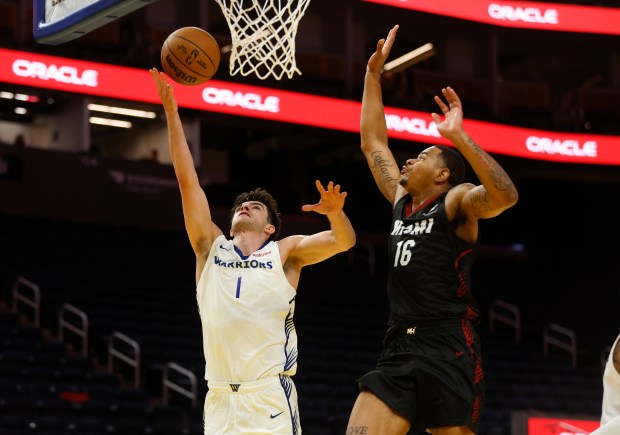 Golden State Warriors' Taran Armstrong (1) takes a shot against Miami Heat's Keshad Johnson (16) in the third quarter of their California Classic Summer League game at Chase Center in San Francisco, Calif., on Tuesday, July 8, 2025. (Nhat V. Meyer/Bay Area News Group)