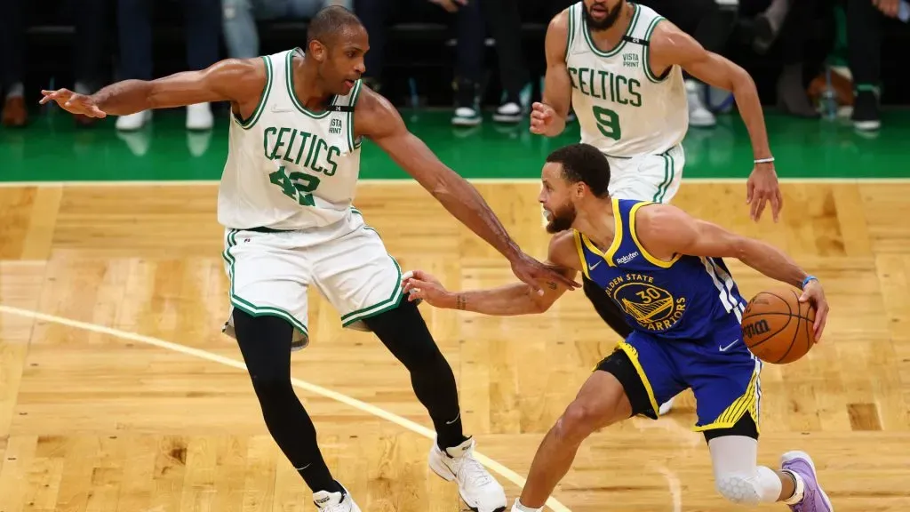 Stephen Curry #30 of the Golden State Warriors is defended by Al Horford #42 of the Boston Celtics. (Elsa/Getty Images)