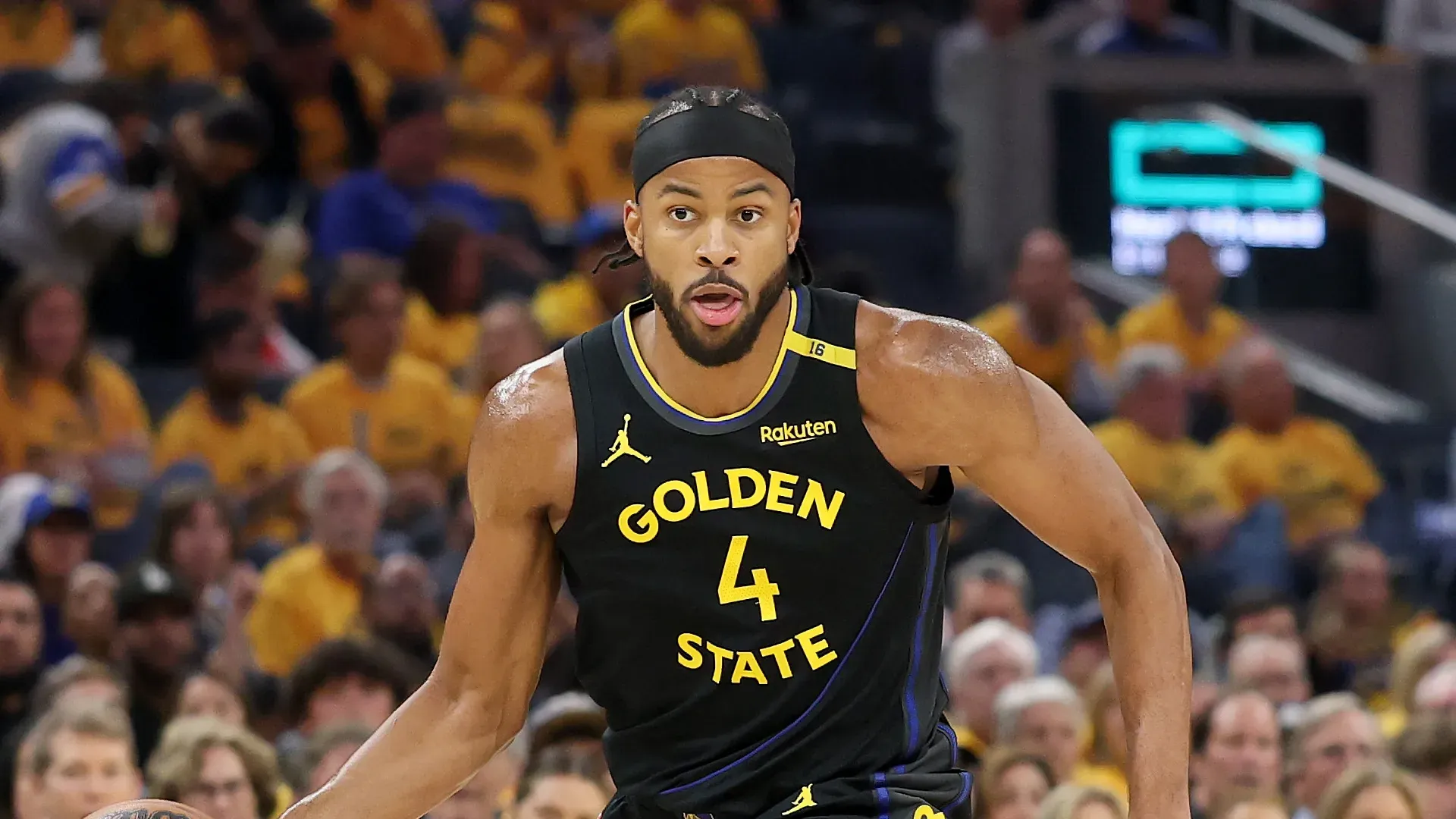 Moses Moody #4 of the Golden State Warriors dribbles the ball against the Houston Rockets in Game Six of the Western Conference First Round NBA Playoffs at Chase Center