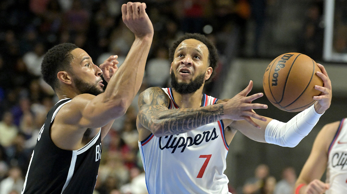 Brooklyn Nets guard Ben Simmons (10) defends Los Angeles Clippers guard Amir Coffey (7) in the first half of a preseason game at Frontwave Arena.