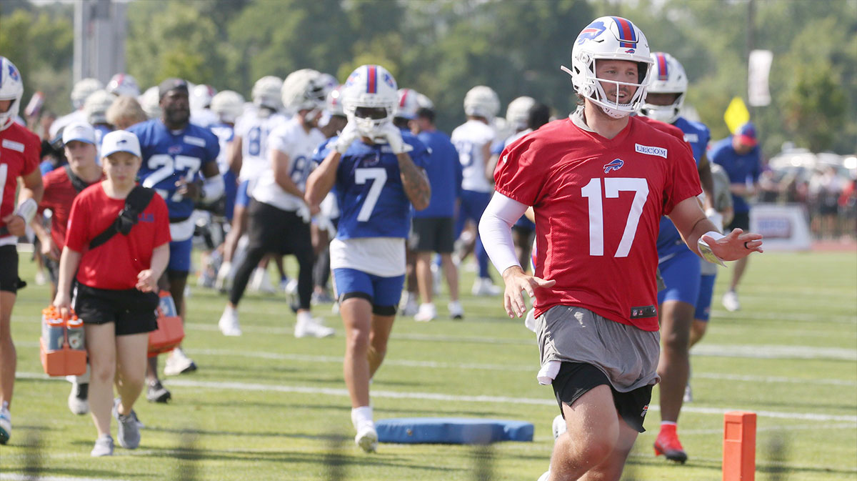 Bills quarterback Josh Allen races to the back practice field ahead of the rest of the quarterback unit during the second day of Buffalo Bills training camp at St. John Fisher University