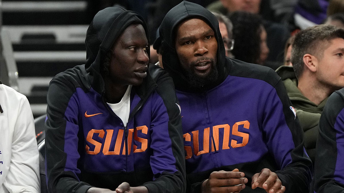 Phoenix Suns center Bol Bol (11) and forward Kevin Durant (35) watch from the bench against the Toronto Raptors in the second half at Footprint Center.