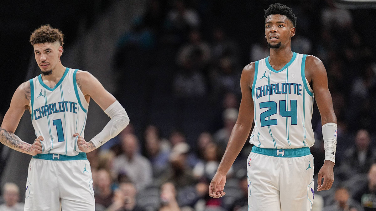 Charlotte Hornets guard LaMelo Ball (1) and forward Brandon Miller (24) at mid court against the Miami Heat during the second half at Spectrum Center.