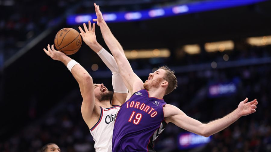 Jakob Poeltl #19 of the Toronto Raptors...