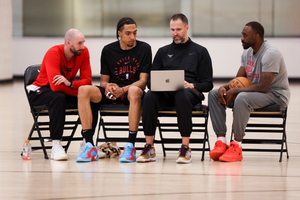 Chicago Bulls forward Noa Essengue listens to player development coordinators Peter Crawford, from left, Austin Dufault, and L.D. Williams during practice at the Advocate Center on Monday, July 7, 2025, in preparation for the Summer League in Las Vegas. (Eileen T. Meslar/Chicago Tribune)