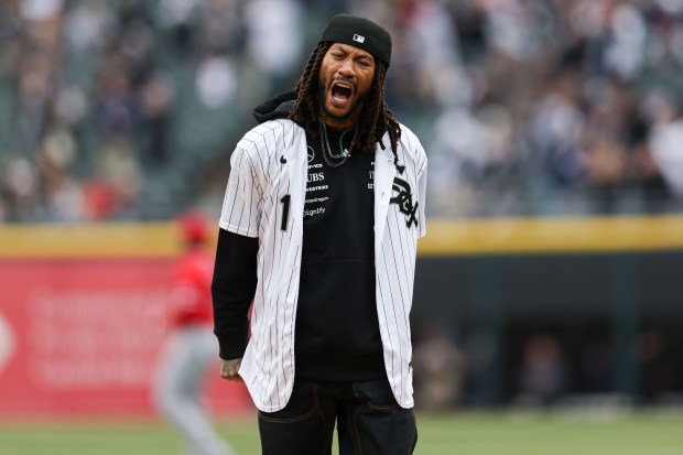 Former Bulls star Derrick Rose yells after throwing out the first pitch before the White Sox season opener against the Angels on March 27, 2025, at Rate Field. (Armando L. Sanchez/Chicago Tribune)