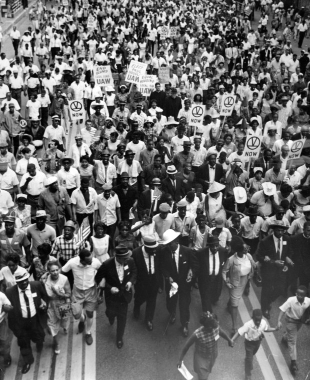 A crowd of 5,000 civil rights marchers swarmed down State Street on July 10, 1966, after a rally at Soldier Field where the Rev. Martin Luther King spoke. King led the march and tacked a list of demands on the door of City Hall. (Chicago Tribune historical photo)