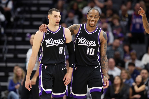The Kings' Zach LaVine, left, and DeMar DeRozan walk off the court together during a game against the Spurs on March 7, 2025, in Sacramento, Calif. (Ezra Shaw/Getty Images)