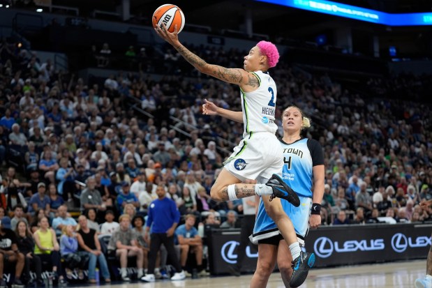 Minnesota Lynx guard Natisha Hiedeman (2) shoots as Chicago Sky guard Moriah Jefferson (4) defends during the first half of a WNBA basketball game Tuesday, July 22, 2025, in Minneapolis. (AP Photo/Abbie Parr)