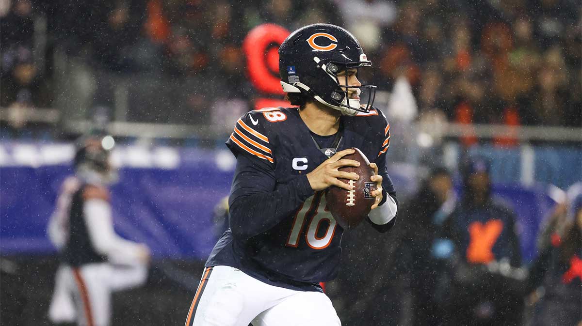 Chicago Bears quarterback Caleb Williams (18) rolls out of the pocket during the third quarter against the Seattle Seahawks at Soldier Field.