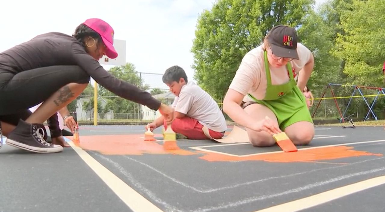 The Cleveland Cavaliers, Councilwoman Jasmin Santana’s office and community members painted the finishing touches on a refurbished courts at Trent Park Friday.