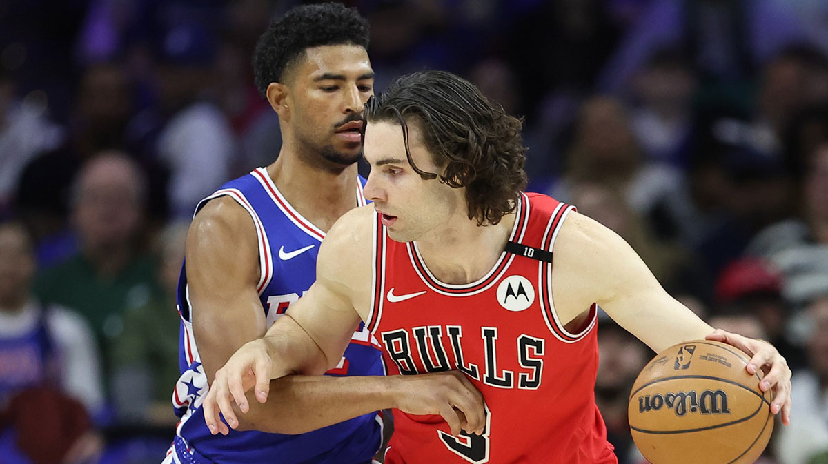 Chicago Bulls guard Josh Giddey (3) controls the ball against Philadelphia 76ers guard Quentin Grimes (5) during the first quarter at Wells Fargo Center.