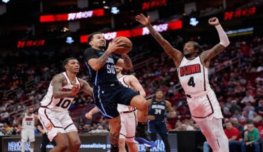 Orlando Magic's Cole Anthony (50) goes up for a shot as Houston Rockets' Jalen Green (4) defends during the first half of an NBA basketball game Monday, March 10, 2025, in Houston. (AP Photo/David J. Phillip)