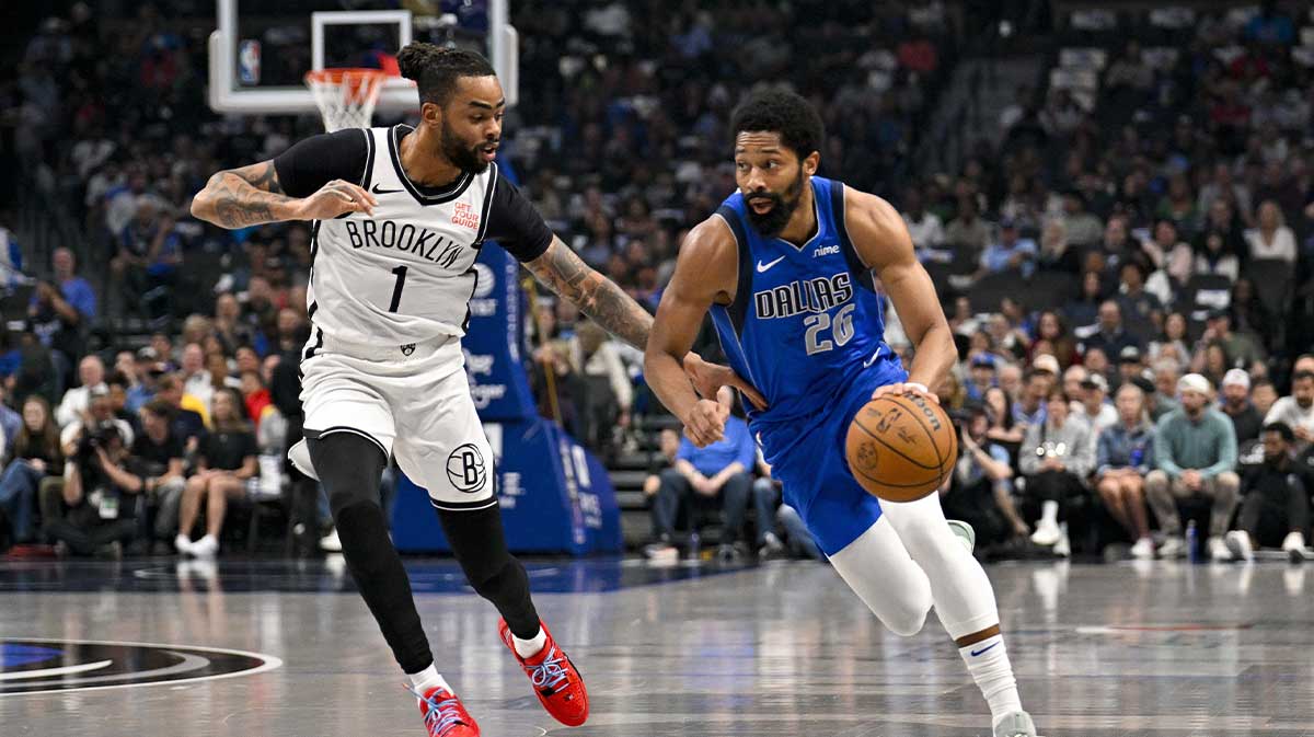 Dallas Mavericks guard Spencer Dinwiddie (26) brings the ball up court past Brooklyn Nets guard D'Angelo Russell (1) during the first quarter at the American Airlines Center.
