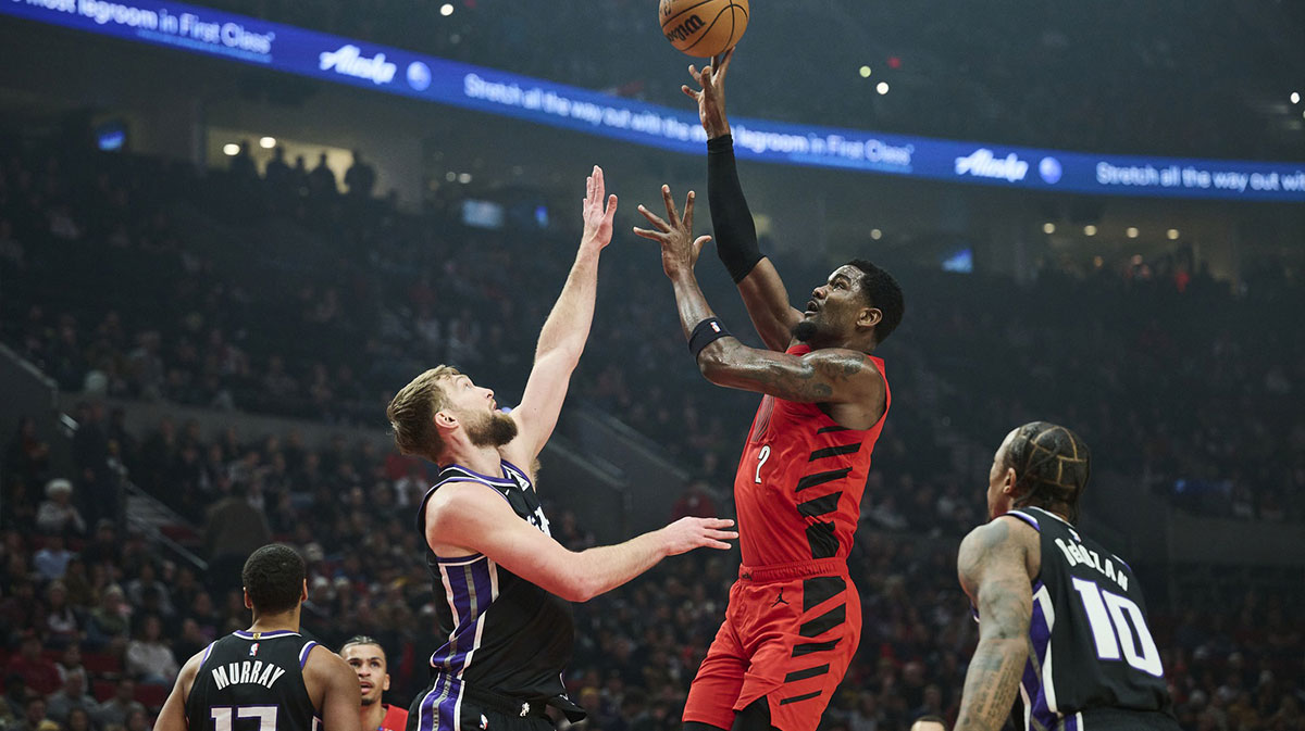 Portland Trail Blazers center Deandre Ayton (2) shoots a jump shot the ball during the first half against Sacramento Kings forward Domantas Sabonis (11) at Moda Center.