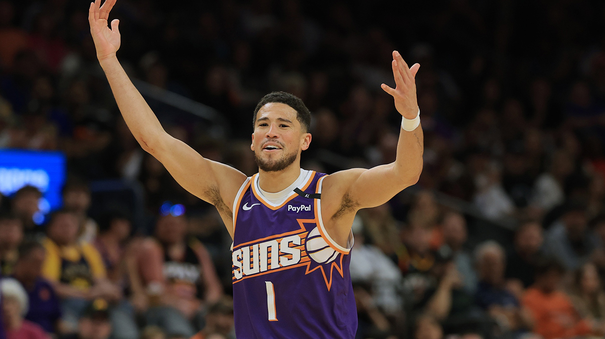Phoenix Suns guard Devin Booker (1) reacts against the Golden State Warriors during the second half at Footprint Center.