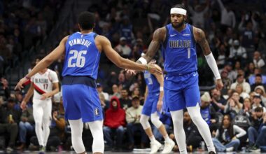 Dallas Mavericks' Spencer Dinwiddie (26) celebrates a three-pointer by Jaden Hardy (1) against the Portland Trail Blazers in the first half of an NBA basketball game, Thursday, Jan. 9, 2025, in Dallas. (AP Photo/Richard W. Rodriguez)