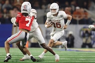 Texas quarterback Arch Manning (16) runs against Ohio State during the first half of the...