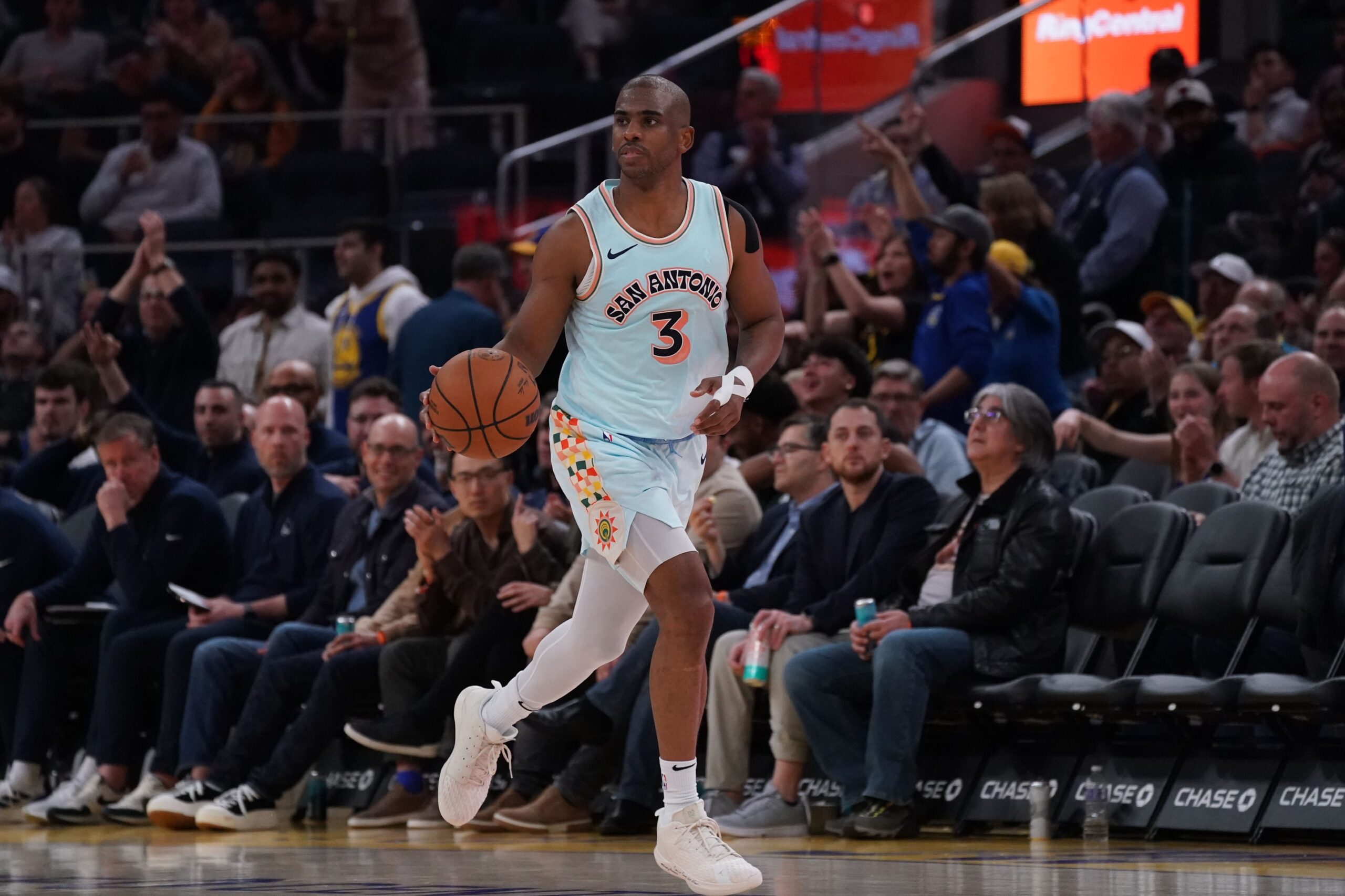 San Antonio Spurs guard Chris Paul (3) dribbles upcourt against the Golden State Warriors in the third quarter at Chase Center.
