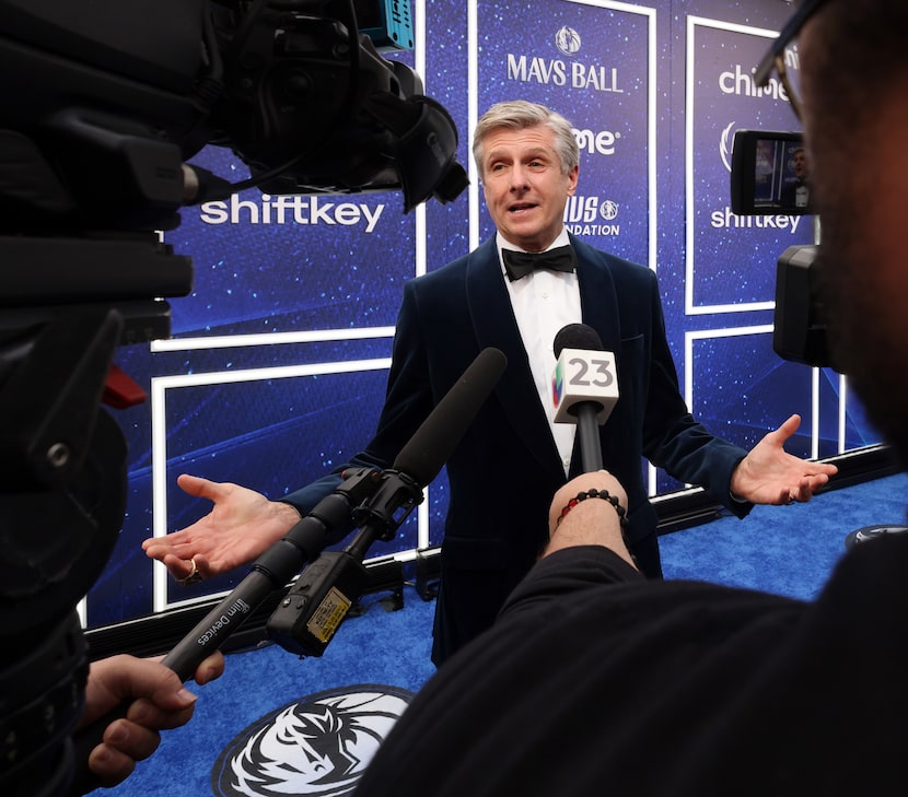 Dallas Mavericks CEO Rick Welts responds to a question from a media member while on the blue...