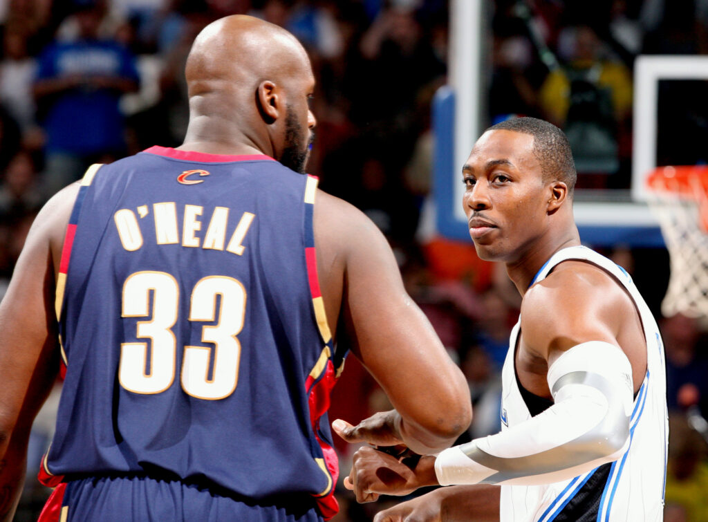 Orlando Magic center Dwight Howard (12) and Cleveland Cavaliers center Shaquille O'Neal (33) acknowledge each other