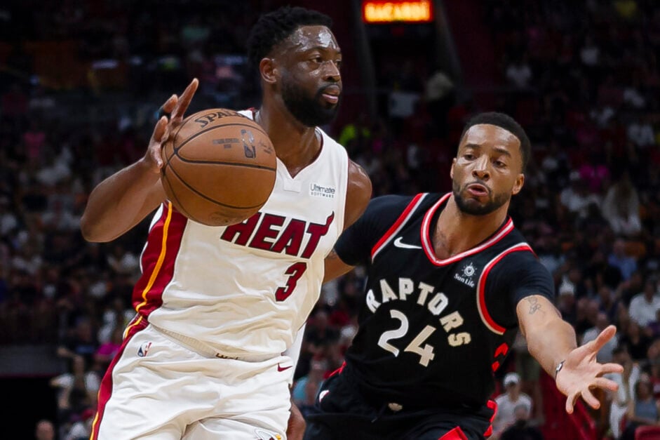 Dwayne Wade trying to get past Norman Powell