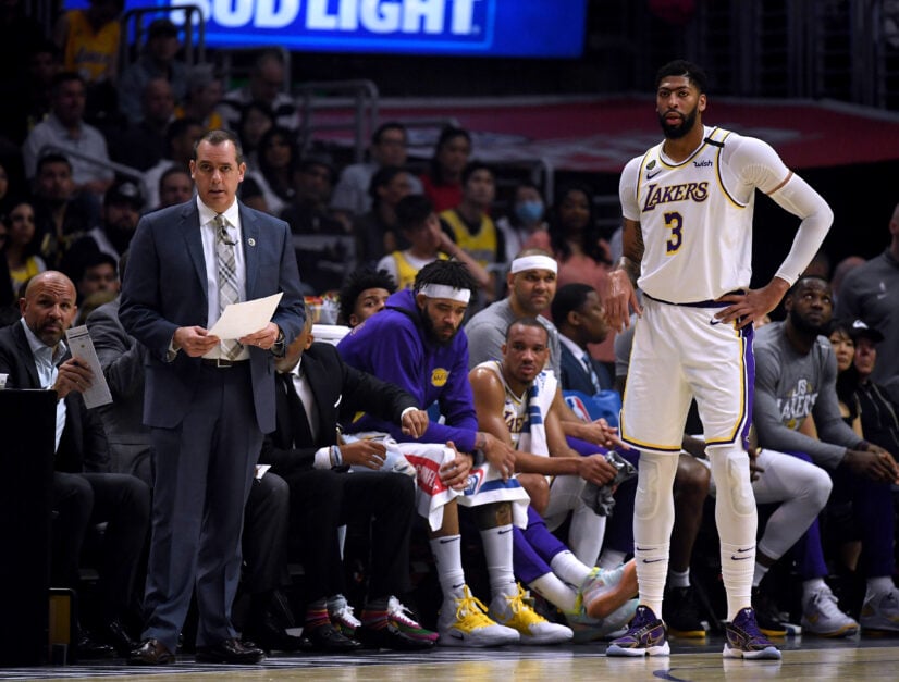 Frank Vogel and Anthony Davis #3 of the Los Angeles Lakers watch play during the first half against the LA Clippers at Staples Center on March 08, 2020 in Los Angeles, California