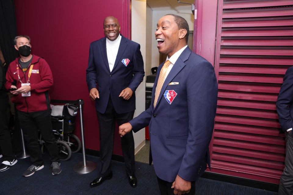 CLEVELAND, OH - FEBRUARY 20: Isiah Thomas and Magic Johnson of the 75th anniversary team talk during the 2022 NBA All-Star Game as part of 2022 NBA All Star Weekend on February 20, 2022 at Rocket Mortgage FieldHouse in Cleveland, Ohio. NOTE TO USER: User expressly acknowledges and agrees that, by downloading and/or using this Photograph, user is consenting to the terms and conditions of the Getty Images License Agreement. Mandatory Copyright Notice: Copyright 2022 NBAE (Photo by Jim Poorten/NBAE via Getty Images)