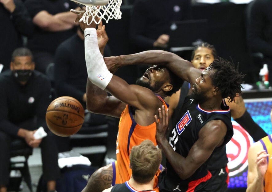 Patrick Beverley #21 of the LA Clippers fouls Deandre Ayton #22 of the Phoenix Suns during the first half in Game Six of the Western Conference Finals at Staples Center on June 30, 2021 in Los Angeles, California.