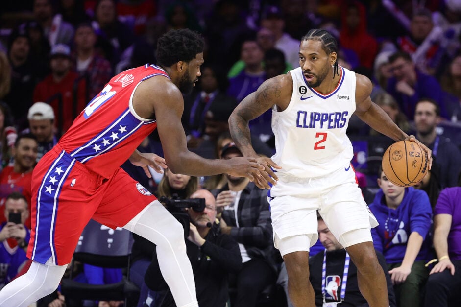 Los Angeles Clippers forward Kawhi Leonard handles the ball against Philadelphia 76ers center Joel Embiid