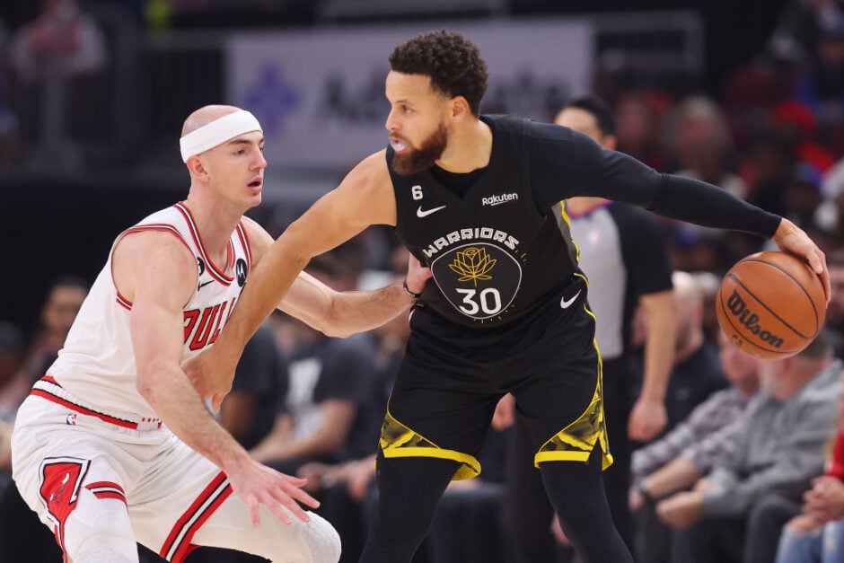 Stephen Curry #30 of the Golden State Warriors is defended by Alex Caruso #6 of the Chicago Bulls during the first half at United Center on January 15, 2023 in Chicago, Illinois.