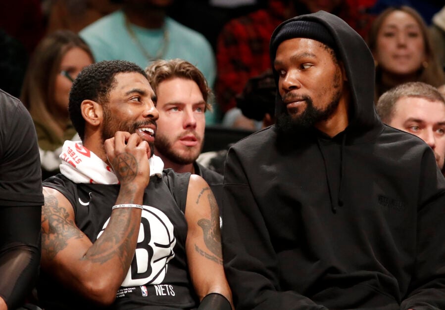 Kyrie Irving #11 (L) and Kevin Durant #7 of the Brooklyn Nets look on against the Los Angeles Lakers at Barclays Center.