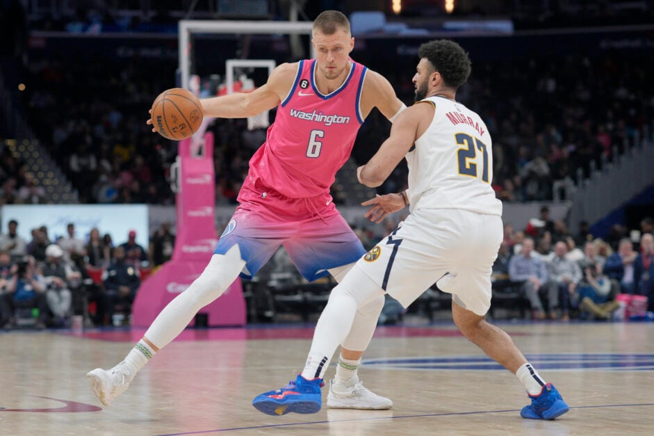 Washington Wizards center Kristaps Porzingis dribbles against the Denver Nuggets