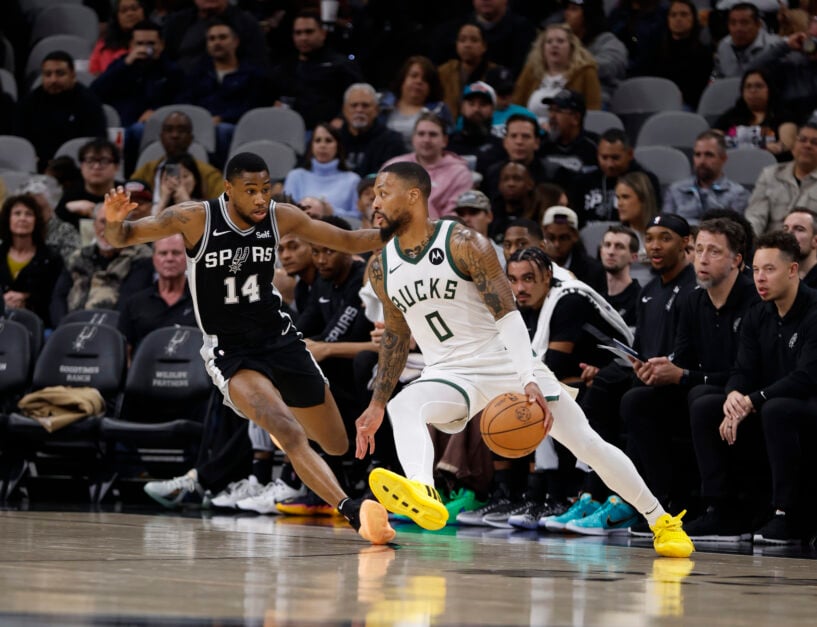 Milwaukee Bucks guard Damian Lillard dribbles against Blake Wesley