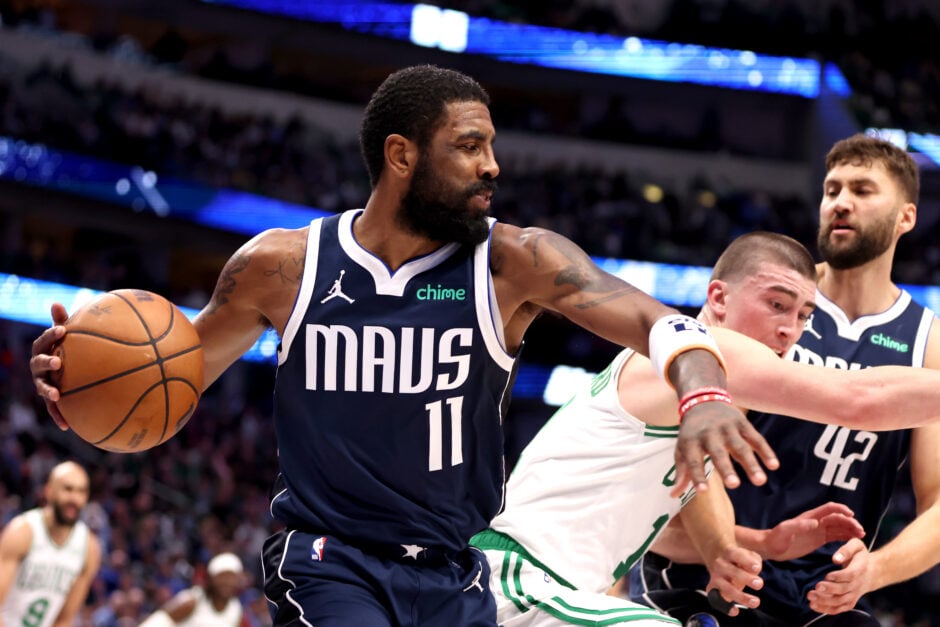 Kyrie Irving #11 of the Dallas Mavericks drives to the basket gainst Payton Pritchard #11 of the Boston Celtics in the second half at American Airlines Center on January 22, 2024 in Dallas, Texas.