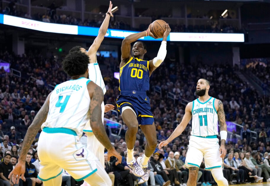 Jonathan Kuminga #00 of the Golden State Warriors leaps in the air looking to shoot against the Charlotte Hornets during the first quarter of an NBA basketball game at Chase Center on February 23, 2024 in San Francisco, California.