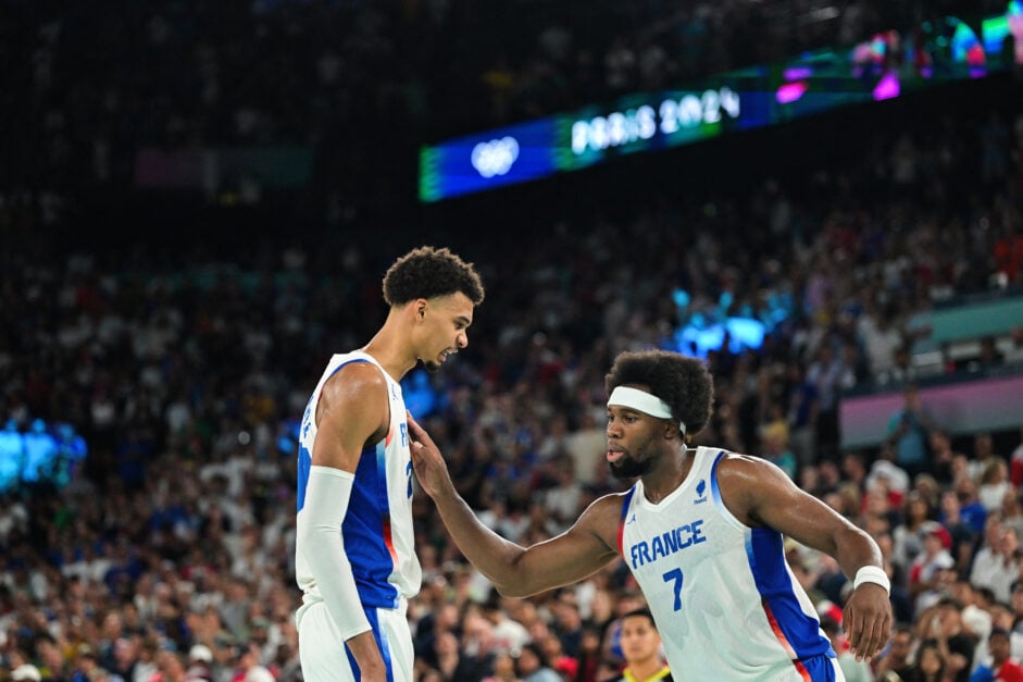 France's #32 Victor Wembanyama (L) and France's #07 Guerschon Yabusele react in the last seconds of the men's quarterfinal basketball match between France and Canada during the Paris 2024 Olympic Games at the Bercy Arena in Paris on August 6, 2024.