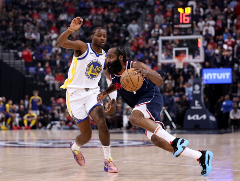 Golden State Warriors forward Jonathan Kuminga guards Clippers' point guard James Harden