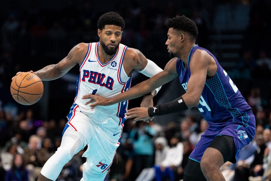 Brandon Miller #24 of the Charlotte Hornets guards Paul George #8 of the Philadelphia 76ers in the fourth quarter of the game during the Emirates NBA Cup at Spectrum Center on December 03, 2024 in Charlotte, North Carolina.